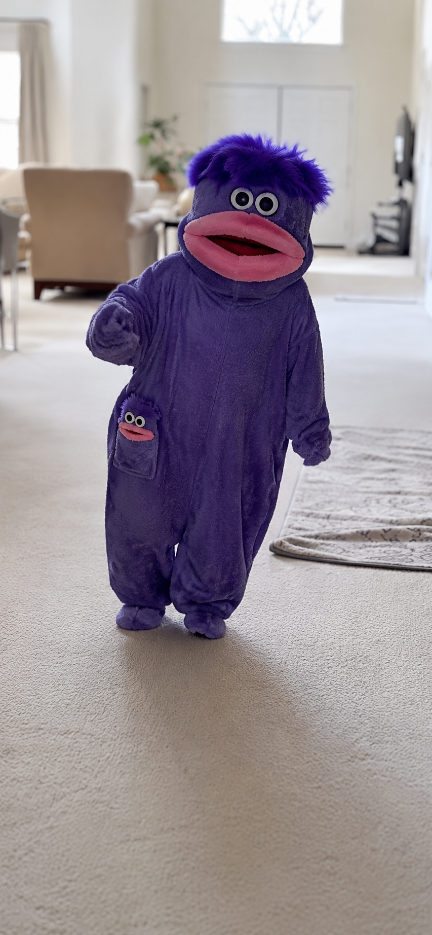 Customer wearing purple Huggybuddies onesie